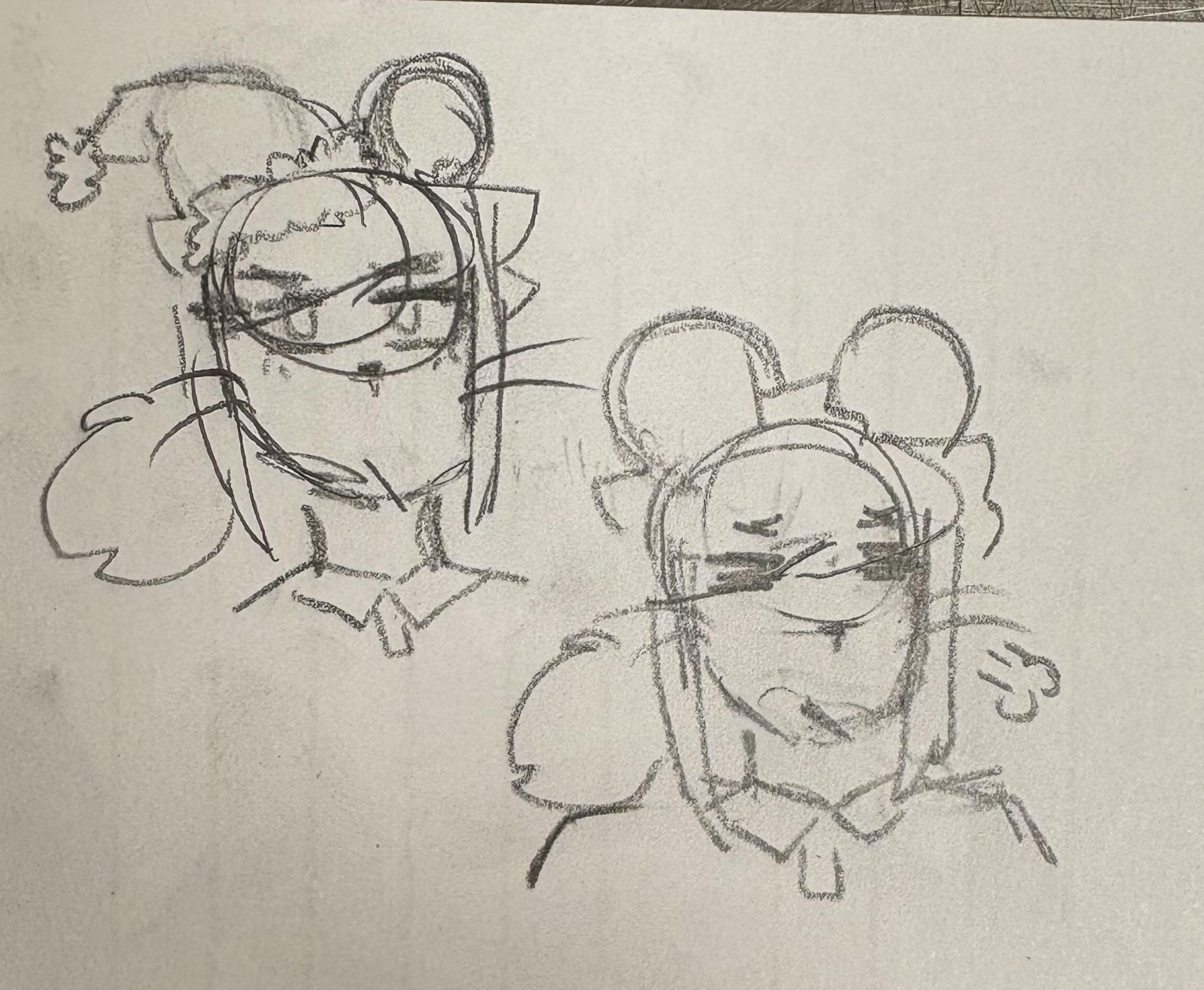 Two Brie doodles, one annoyed and wearing a Santa hat, the other sighing